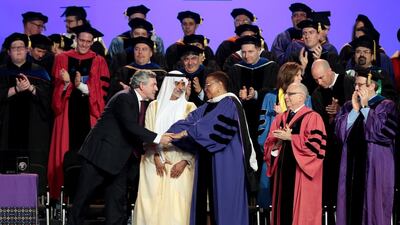 Sheikh Nahyan bin Mubarak, Minister of Culture, Youth and Community Development, watches as Gordon Brown, former British premier, greets Graca Machel, widow of Nelson Mandela, at New York University Abu Dhabi. Christopher Pike / The National