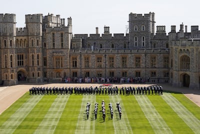 Royal Marines and members of the band line up during a ceremony to honour the Royal Navy personnel who took part in Queen Elizabeth II's funeral. Reuters