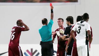 Al Wahda's Damian Diaz, centre, is given his marching orders. Christopher Pike / The National