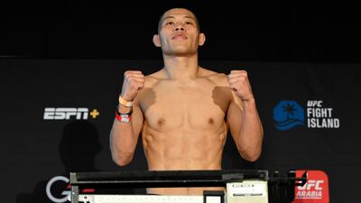 Li Jingliang of China poses on the scale during the UFC weigh-in at Etihad Arena on UFC Fight Island. Jeff Bottari / Zuffa LLC / Getty Images / UFC