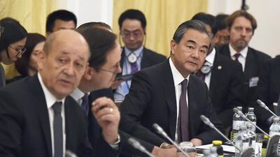 Chinese Foreign Minister Yi Wang (R) joins counterparts backing the the Iran nuclear deal to try salvage the agreement two months after President Donald Trump announced a unilateral US withdrawal. - Austria OUT / AFP / APA / HANS PUNZ
