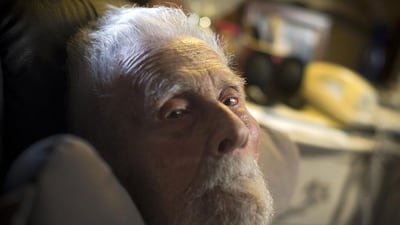 111-year-old Dr Alexander Imich the world's oldest living man poses for a photograph during an interview with Reuters at his home on New York City's upper west side, 9 May, 2014. Dr Imich, who holds a PhD in Zoology, was born in Poland on 4 February, 1903, fled Poland when the Nazis took over in 1939, survived a slave labor camp in Russia and moved to the United States in 1951 where he became an author on parapsychology. Reuters
