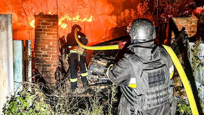Ukrainian firefighters tackle a fire after a Russian attack in Kharkiv. AP