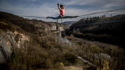 A participant balances on a slackline over the former quarry, near village of Srbsko, Czech Republic. About 50 participants from Czech Republic, Slovakia and Poland took part in spring highline season opening. Martin Divisek / EPA