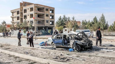 Afghan security forces inspect the site of a car bomb attack, which targeted a convoy of Ministry of Interior Affairs advisors, in Kabul. According to the media at least seven people were killed and 18 others wounded in the blast. EPA