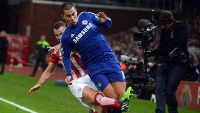 Stoke City’s Phil Bardsley (back) challenges Chelsea’s Eden Hazard during the English Premier League soccer match between Stoke City and Chelsea at the Britannia Stadium in Stoke, Britain, 22 December 2014. EPA/NIGEL RODDIS