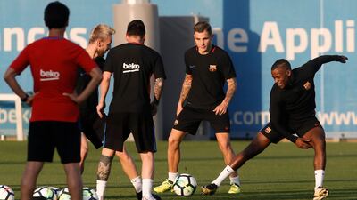 Barcelona defender Nelson Semedo, right, takes part in the training session. Pau Barrena / AFP