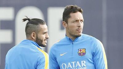 Adriano, right and Douglas of Barcelona take part in the team’s training session on Friday. Andreu Dalmau / EPA