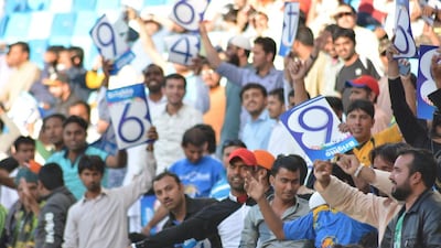 Fans wave signs at the Pakistan Super League match in Dubai on Friday. Photo Courtesy / PSL / February 5, 2016