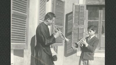 Student playing the trumpet with Father Aletto, circa 1949-1950. Copyright Collège de la Sainte Famille