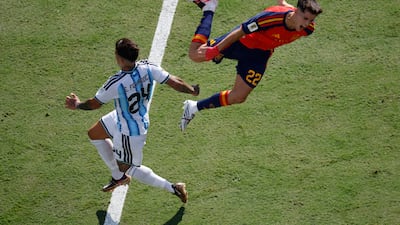 Argentina's Enzo Fernandez fouls Pau Cubarsi of Spain resulting in the midfielder's sending off. Reuters