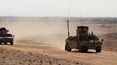 Afghan security officials patrol in Helmand, Afghanistan. The US conducted an airstrike in the province on March 4, 2020. EPA