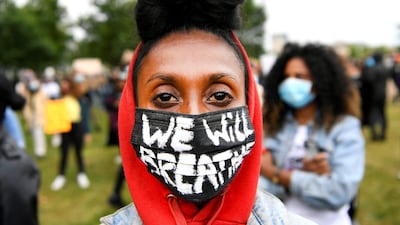 A demonstrator wearing a protective mask attends a Black Lives Matter protest in Amsterdam, Netherlands. REUTERS