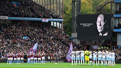 Players and fans observe a minute's applause for late England and Manchester United midfield great Bobby Charlton. AFP