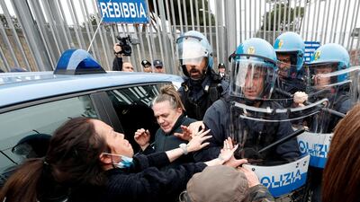 The relatives of inmates clashe with police outside of Rebibbia Prison during a prisoners' revolt, after family visits were suspended due to fears over coronavirus contagion, in Rome, Italy. Reuters