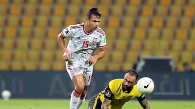 UAE's Fabio De Lima under pressure from Guilherme Lucrecio of Malaysia. Chris Whiteoak / The National