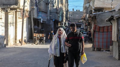Palestinian refugee Amna Abu Mustafa, 88, born in 1932 in Beersheba, walks with her grandson near her house in the streets of Khan Younis refugee camp in the Gaza Strip. World Refugee Day is marked on 20 June each year to highlight the suffering of the tens of millions of people forced to flee their homes due to war or persecution. Nearly one-third of the registered Palestine refugees, more than 1.5 million individuals, live in 58 recognized Palestine refugee camps in Jordan, Lebanon, the Syrian Arab Republic, the Gaza Strip and the West Bank, including East Jerusalem. EPA