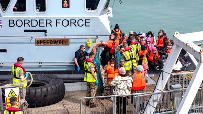 People disembarking at Dover Docks after British Border Force Officials intercepted two boats in the English Channel. EPA