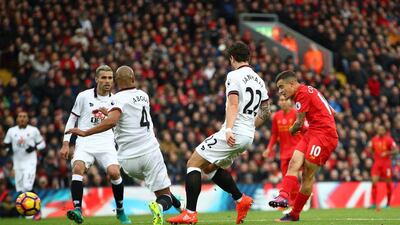 Philippe Coutinho of Liverpool scores his side’s second goal. Clive Brunskill / Getty Images