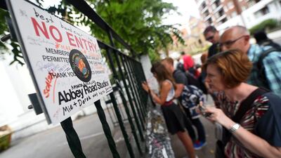 Fans of The Beatles gather outside the Abbey Road studios. EPA