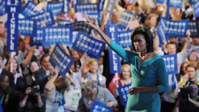 Michelle Obama, wife of US Democratic presidential candidate Barack Obama, smiles after addressing the Democratic National Convention at the Pepsi Center in Denver on Aug 25 2008.