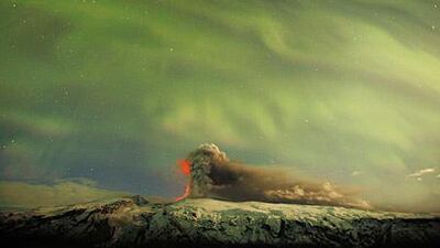 A force older than humanity, the ash plume of Eyjafjallakokul emerges from an Icelandic glacier beneath the Northern Lights last week.