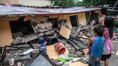 A collapsed building in Bogo city, Philippines after an earthquake struck on September 30. AP