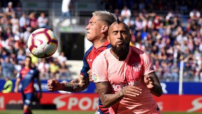Barcelona midfielder Arturo Vidal in action against Huesca midfielder 'Chimy' Avila. EPA