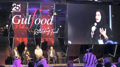 Amal Al Ahmadi, senior analyst in the agriculture development and health sector at the Ministry of Climate Change and Environment, speaks on a panel at Gulfood with Tjalling van den Burger, business development manager at Winnow. Pawan Singh / The National