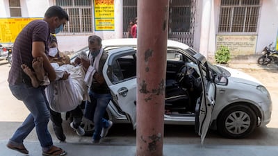 Relatives carry Jagdish Singh, 57, who is experiencing breathing problems, to a government-run hospital for treatment, amidst the coronavirus disease pandemic, in Bijnor district, Uttar Pradesh, India. Reuters