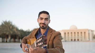 Firas Kiftaro, a Syrian electrical engineer, who learned to play the guitar through YouTube, is photographed on campus at the American University of Sharjah. Sarah Dea / The National