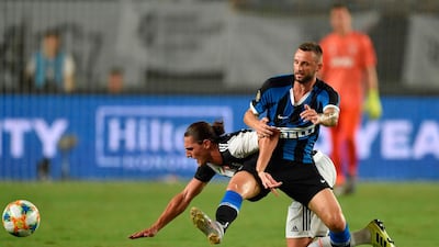 Stefano Sensi (back) fights for the ball with Inter Milan's Marcelo Brozovic. AFP
