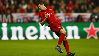Robert Lewandowski of Bayern Munich heads in their first goal on Wednesday night against Arsenal in the Champions League. Michael Dalder / Reuters
