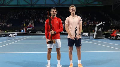 Novak Djokovic and Sebastian Korda pose with their trophies after the Adelaide International final. Reuters