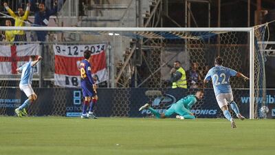 Ibiza players celebrate after taking the lead against Barcelona. EPA