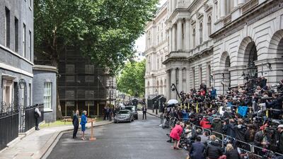 Lonely at the top: British prime minister Theresa May outside 10 Downing Street after returning from Buckingham Palace to seek permission from Queen Elizabeth to form a government on June 9, 2017. Her husband Philip stands behind her. Mrs May's Conservative party failed to win a majority and a hung parliament has been declared. Carl Court / Getty Images