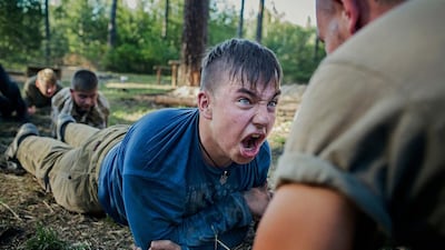 A teenager is emotionally charged by his instructor during tactical training at the Azov battalion's summer camp, near the village of Buzova, 30 kilometres west of Kiev, Ukraine. It is the second summer the Ukrainian volunteer battalion has organised a patriotic camp for children. Photo Alex Masi.