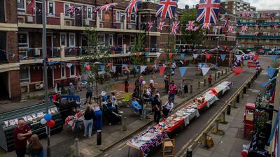 Residents of the Kirby estate in Bermondsey enjoy a party with a BBQ, drinks and a bouncy castle to celebrate the coronation. Getty Images