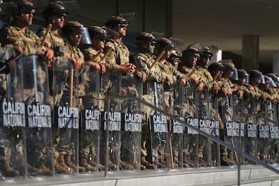 California's National Guard personnel positioned at the Federal Building in downtown Los Angeles. AP