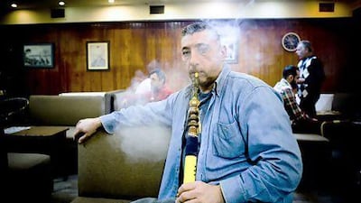 Ahmet Akkaya, who runs a snack kiosk in Instanbul, says shisha is part of an unhurried and sociable Turkish way of life. Kerem Uzel for The National