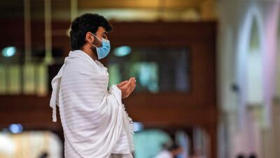 A pilgrim attends prayers. AFP