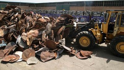 Satellite dishes and receivers are piled up before being destroyed in the Iranian capital, Tehran, on July 24, 2016. Hossein Zohrevand/Tasnim News/AFP