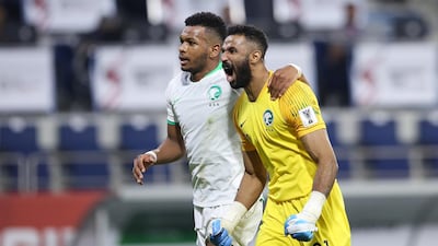 Saudi Arabia goalkeeper Mohammed Alowais and teammate Ali Hadi Albulayhi celebrate. EPA