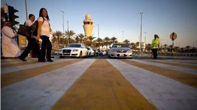Taxis wait in a queue in front of the Terminal 1 at the Abu Dhabi International Airport.