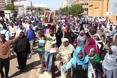 Supporters of deposed Sudanese president Omar Al Bashir rally after his conviction of graft near the presidential palace in the capital Khartoum. AFP