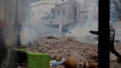 Anti-riot police officers clash with people protesting against President Abdelaziz Bouteflika, in Algiers. Reuters