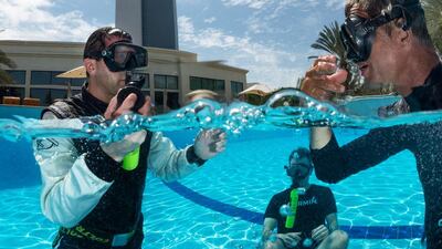 Michael Goulian of the United States seen during the underwater rescue training before the first stage of the Red Bull Air Race World Championship in Abu Dhabi. Predrag Vuckovic / Red Bul