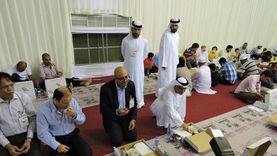 Canada’s ambassador to the UAE, Arif Lalani breaks his fast at Sheikh Zayed Grand Mosque. The Canadian mission in Abu Dhabi volunteered at the iftar to mark its national day. Courtesy Mark Graham / Embassy of Canada