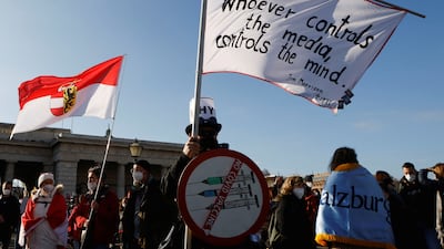 Demonstrators hold flags during the protest. Reuters