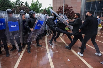Riot police clash with supporters of ousted party leader Ozgur Ozel. Getty Images